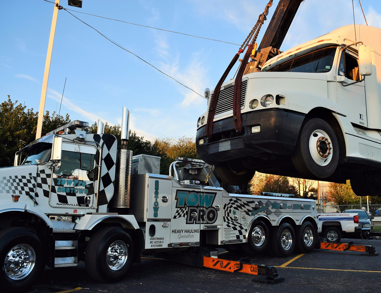 Tow Pro truck lifting semi-truck for special transport job