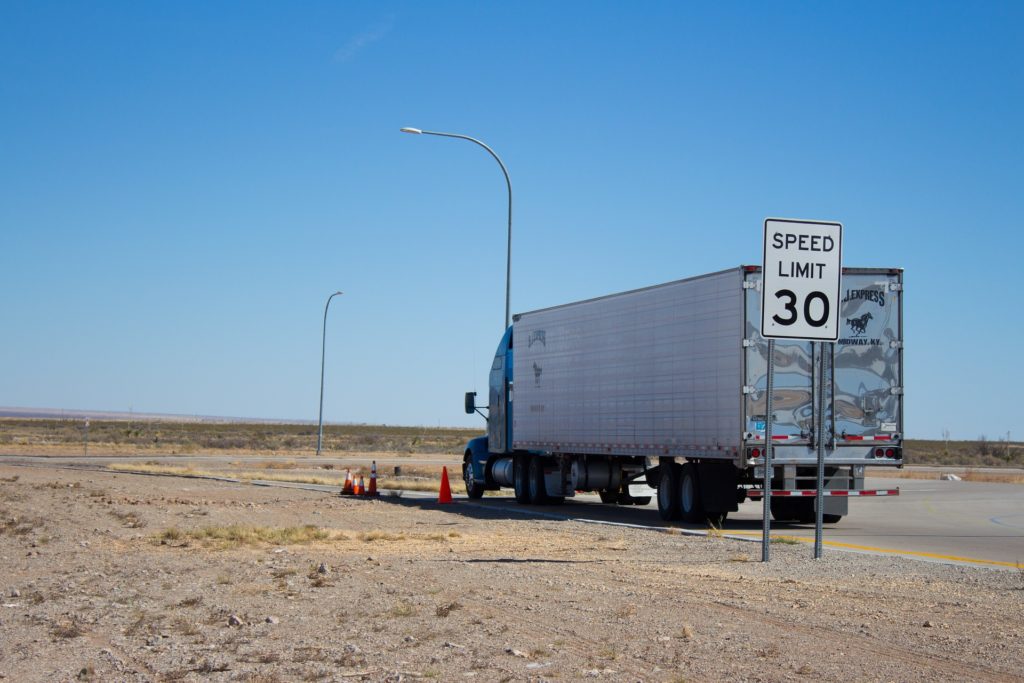 semi-truck driving on remote american highway