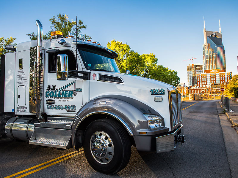 A.B. Collier towing services truck with Nashville skyline in the background